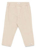 Pantaloni a disco per neonata Donsje beige con elastico in vita – Accessorio premium elegante